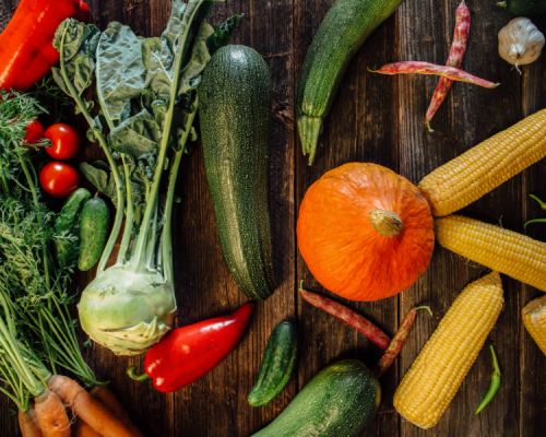 High angle view of fresh vegetables on wooden background